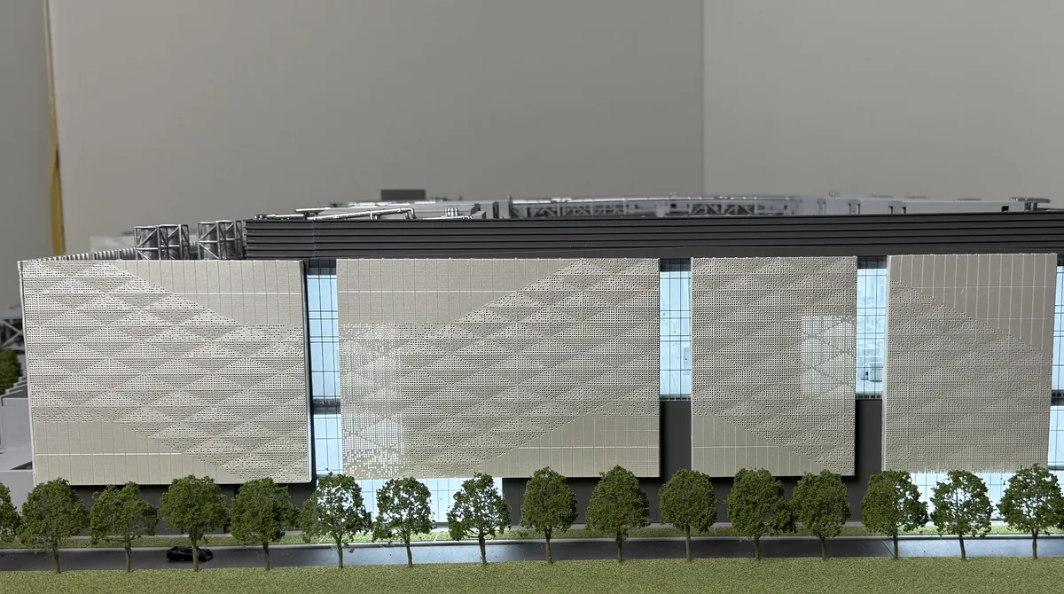 Perforated façade panels and illuminated glazing on a 1:200 laboratory architectural model